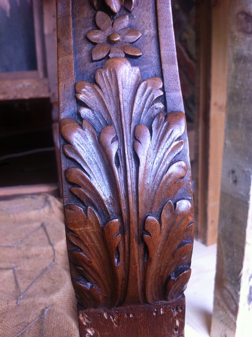 Under chair arm scroll