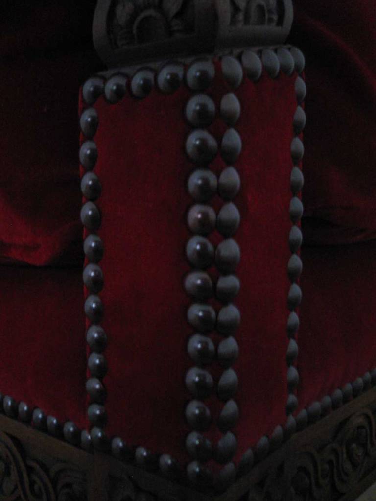 Photo: Detail of the decorative nailing on the corner of the chair